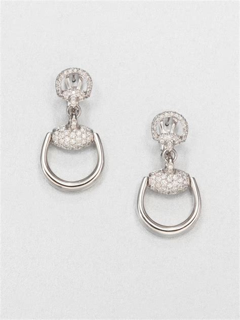 gucci white gold stud earrings.